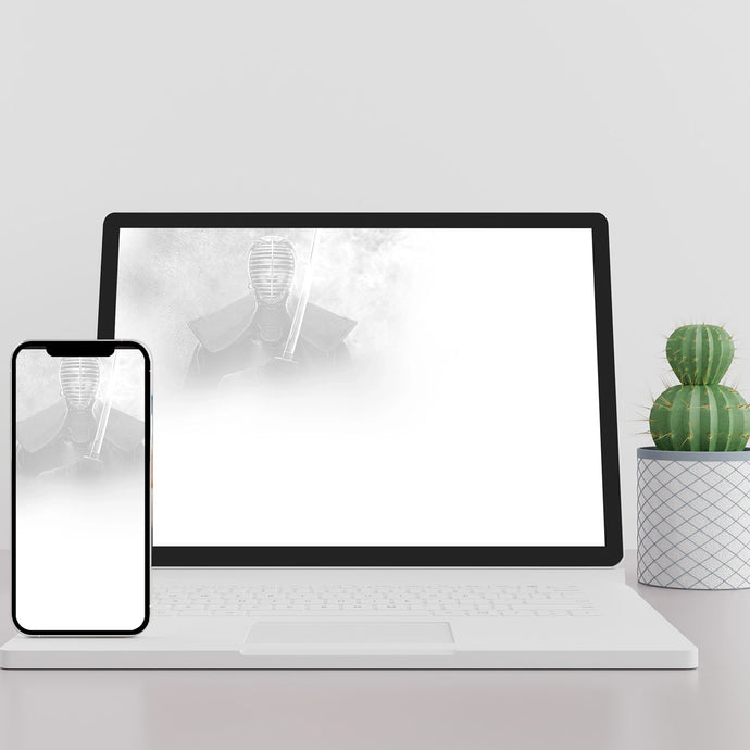 Laptop and smartphone on a white surface with a Shogun silicon image in the background
